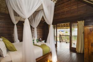 Voodi või voodid majutusasutuse Laguna Reef Huts toas