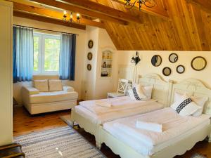 a large bedroom with two beds and a couch at Гриль Станція in Bila Tserkva