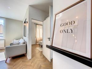 a room with a window with a good only sign at AppartChic - appartement standing - plein Centre & Parking privé in Créon