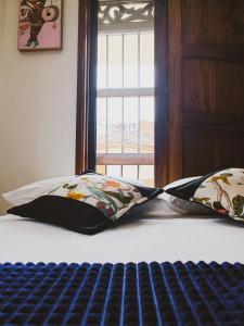 Postel nebo postele na pokoji v ubytování Famy Hostal Nardo's