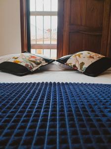 Postel nebo postele na pokoji v ubytování Famy Hostal Nardo's