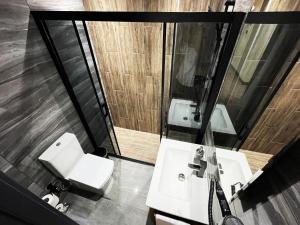 a bathroom with two sinks and a mirror at GRAND ÜSKÜDAR OTEL in Istanbul +45 photos