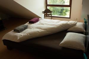 Postel nebo postele na pokoji v ubytování B&B Moensberg