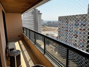 a balcony with a view of a building at Hotel Bonaparte Flat Particular A in Brasilia +1 photo