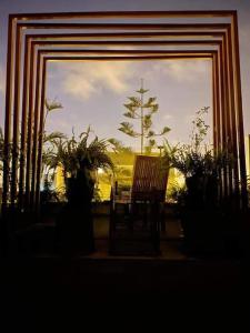 a view of a window with a chair and plants at Beautiful in Lima