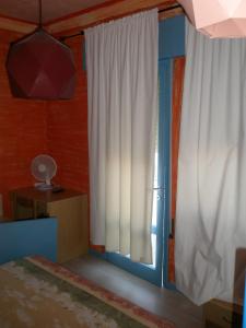 Postel nebo postele na pokoji v ubytování Hotel Antonella
