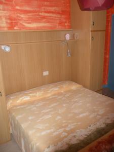 Postel nebo postele na pokoji v ubytování Hotel Antonella