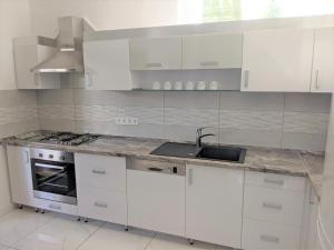 Kuchyň nebo kuchyňský kout v ubytování Marica Apartman