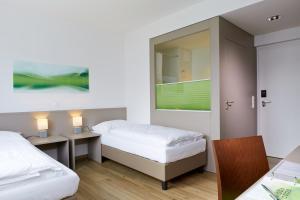 Posteľ alebo postele v izbe v ubytovaní Good Rooms GmbH Guntramsdorf + 37 fotografií