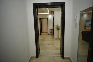 a hallway with a door leading into a room at Marina Agadir Sunny Holiday in Agadir