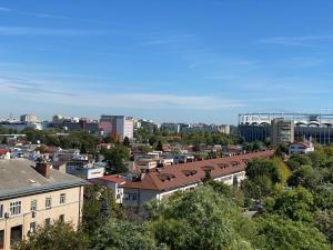 a view of a city with buildings and trees at National Park Boutique Studio in Bucharest