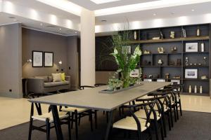 a dining room with a large table and chairs at Believe Madero Hotel in Buenos Aires