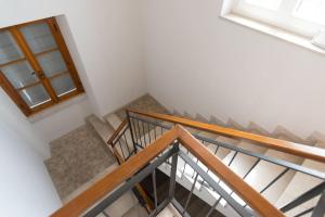 an overhead view of a staircase in a house at Garda Friends Apartments in Toscolano Maderno