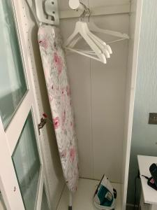 a room with a curtain hanging from a door at Lochindaal Hotel in Port Charlotte