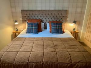 Postel nebo postele na pokoji v ubytování Lochindaal Hotel