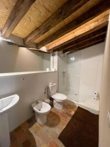a bathroom with a sink and a toilet and a shower at Requesens in La Jonquera