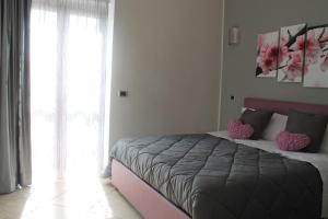 Łóżko lub łóżka w pokoju w obiekcie B&B Vesuvio Smiling