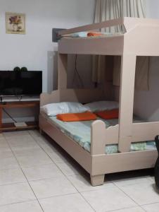 a bunk bed in a room with a tv at Wow unit 2 for 6 guests up to 8 in Baguio