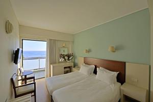 Postel nebo postele na pokoji v ubytování Esperia Hotel + 37 fotografií