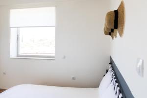 Postel nebo postele na pokoji v ubytování Memi Houses