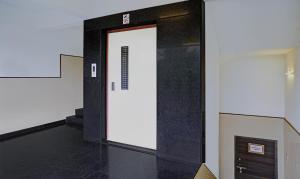a elevator with a door in a building at Itsy Hotels Oasis Pride in Nashik