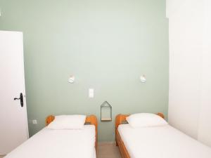 Postel nebo postele na pokoji v ubytování Memi Houses