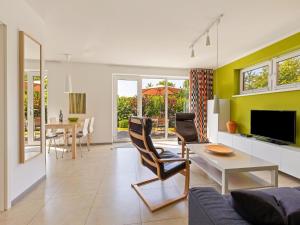 a living room with a couch and a table at Beautiful Seaside Holiday Home in Zierow in Zierow