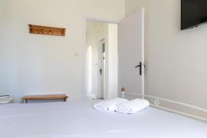 Postel nebo postele na pokoji v ubytování Memi Houses