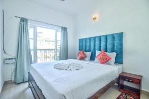 Postel nebo postele na pokoji v ubytování Santa Monica Resort - Calangute