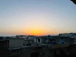 a view of the sunset from a rooftop at Entire 1 BR Apartment: Netflix, Youtube. in Islamabad