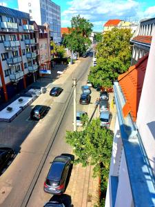a view of a city street with cars parked at Apartment Studio BOSSANOVA in Bydgoszcz