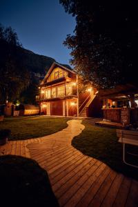 a house at night with a walkway in the yard at Lodgen Stryn in Stryn
