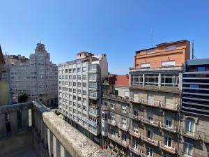 a group of tall buildings in a city at Hotel Arsus in Vigo