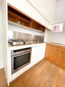 Kuchyňa alebo kuchynka v ubytovaní La Pigna Boutique Apartment