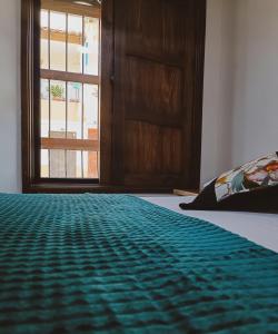 Postel nebo postele na pokoji v ubytování Famy Hostal Nardo's