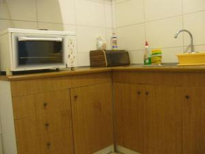 A kitchen or kitchenette at Aegean Hotel