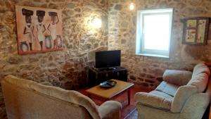 TV a/nebo společenská místnost v ubytování Casa grande cerca de la playa