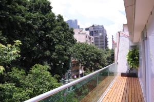 a balcony with a view of a city at London 248 in Mexico City