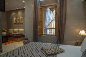 Voodi või voodid majutusasutuse Riad L'Etoile D'Orient toas