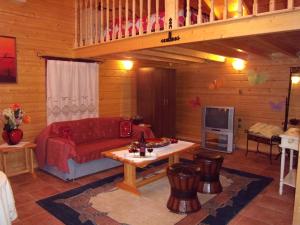 a living room with a couch and a table at Arhontiko Kordopati Traditional Guesthouse in Daras