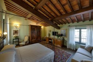 Łóżko lub łóżka w pokoju w obiekcie Hotel Mulino di Firenze - WorldHotels Crafted