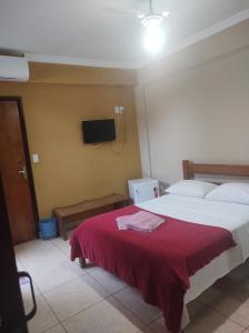 Ein Bett oder Betten in einem Zimmer der Unterkunft Pousada Bontempo