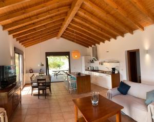 a living room with a couch and a table at Casa Rural Las Angosturas (Caminito del Rey) in El Chorro