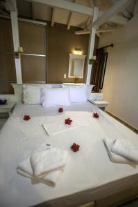 Postel nebo postele na pokoji v ubytování Kolokotronis Hotel & Spa
