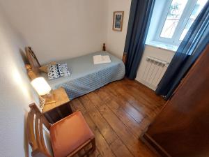 Ένα ή περισσότερα κρεβάτια σε δωμάτιο στο Casa do Sobrado Arouca