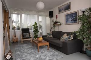 a living room with a couch and a table at Bright and spacious 1 bed flat in Camberwell in London