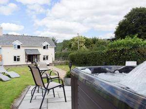 a patio with chairs and a water fountain at Herrock View in Evenjobb