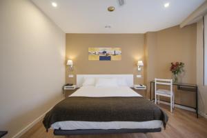 Cama o camas de una habitación en Hotel Miño