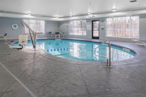 a large swimming pool in a large room with at Holiday Inn Spokane Airport, an IHG Hotel in Spokane