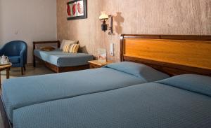 A bed or beds in a room at Hersonissos Maris